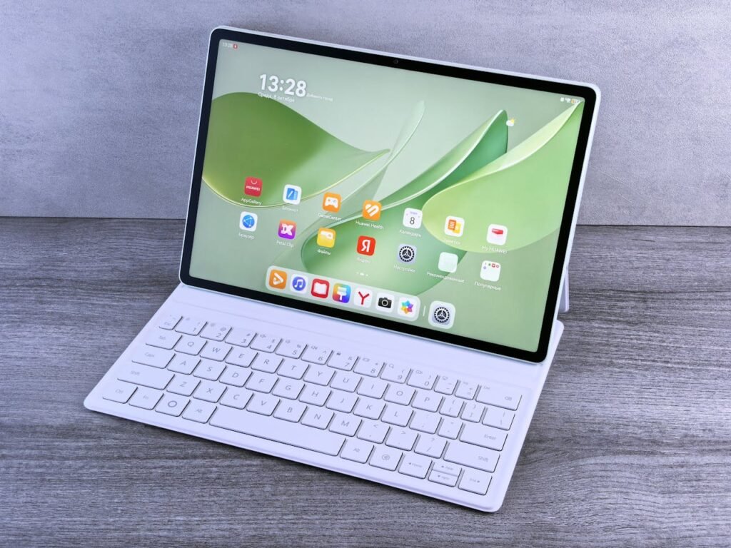 Tablet with keyboard displaying apps on a clean wooden desk. Perfect for tech and productivity themes.